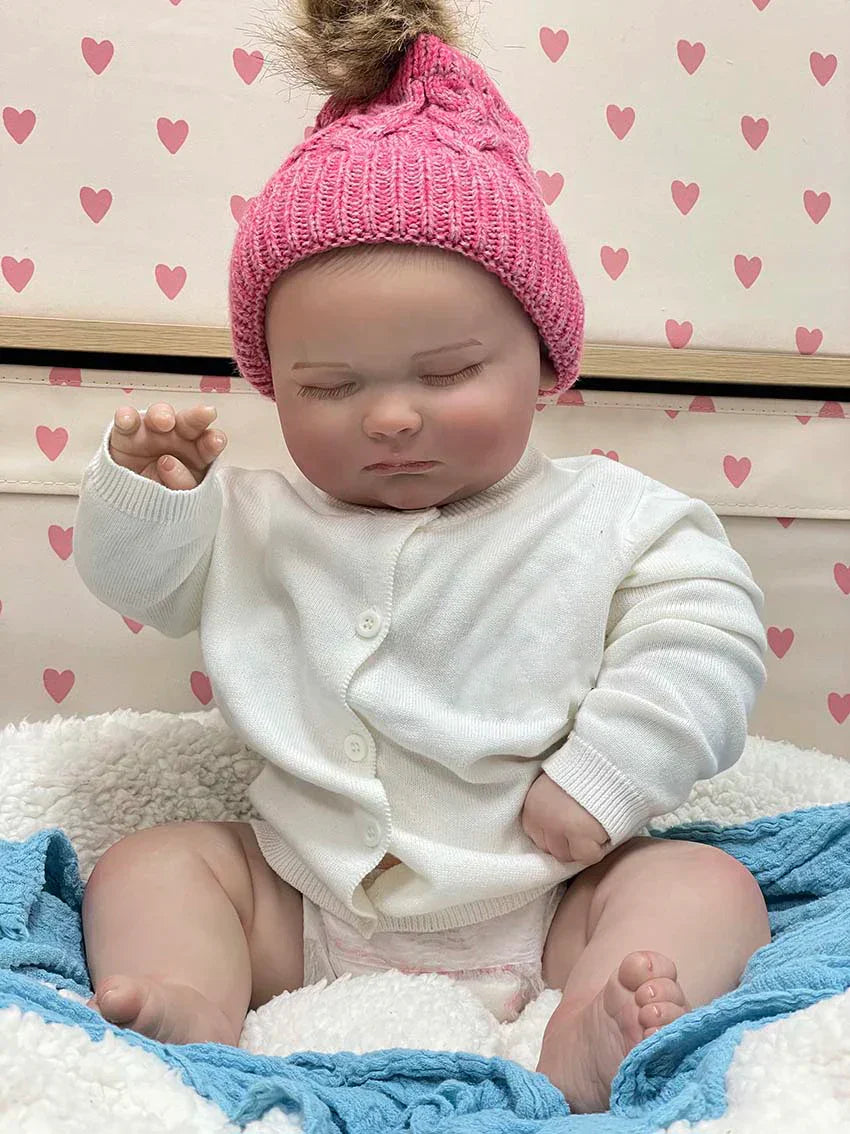 Amelie – 55 cm-es édes, alvó újjászületett baba puha, ölelős testtel